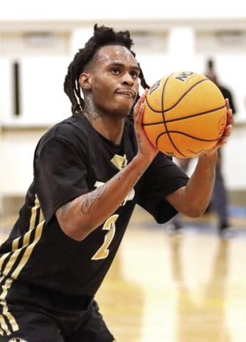 Greene County senior Kamari Smith (2) at the free throw line in a win over Lake Oconee Academy last Friday. LANCE McCURLEY/Staff