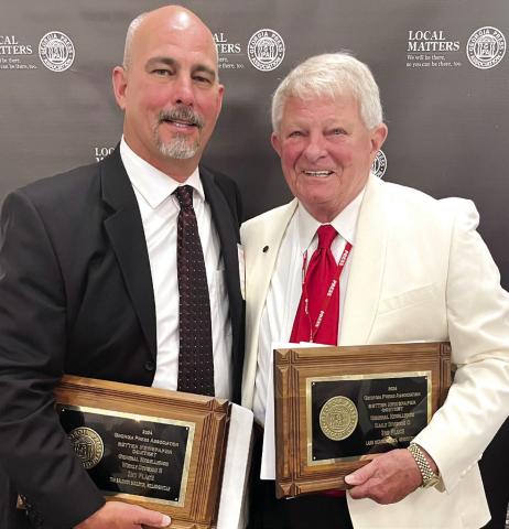 Smith Communications President and CEO A. Mark Smith Sr. (right) with General Manager Matt Smith attended the annual Georgia Press Association convention at Jekyll Island last week. CONTRIBUTED