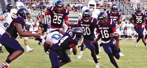 DJ Bland (4) tries to avoid a Glenn Hills defender while a pack of War Eagles rush to the ball. ARELLA CASH/Staff