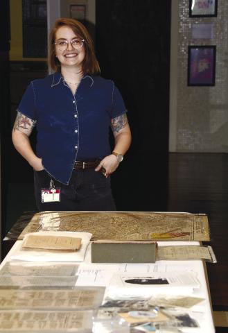 Kathryn Manis with the Hargrett Rare Books and Manuscripts Library displayed several unique Putnam County and Eatonton-related artifacts and publications during her one-day visit to Eatonton’s Old School History Museum. IAN TOCHER/Staff