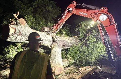 Putnam County Public Works crews clear trees from roadways after the storm. Tri-County EMC reported almost 5,000 meters were without power in Putnam and Jones counties. (Photo via social media)