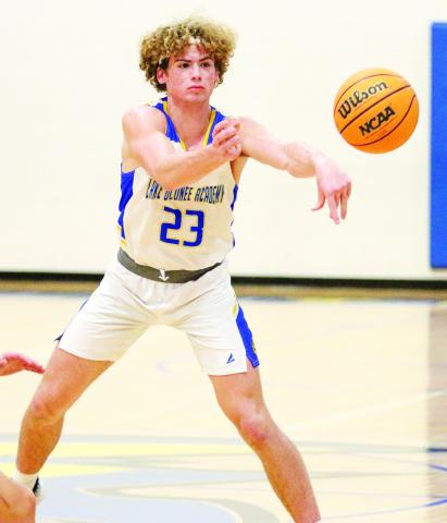 LOA’s Torrin Maddox (23) d umps the ball off to a teammate. LANCE McCURLEY/Staff