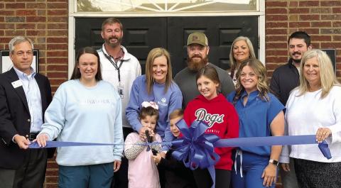 Whitney Williams (middle) celebrated opening her new private practice with a ribbon cutting ceremony, alongside family, employees and members of the Madison-Morgan Chamber of Commerce. CONTRIBUTED