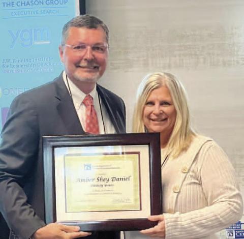 Madison-Morgan Chamber of Commerce President/CEO Shey Daniel (right) receives the Service Award from the Georgia Association of Chamber of Commerce Executives. CONTRIBUTED