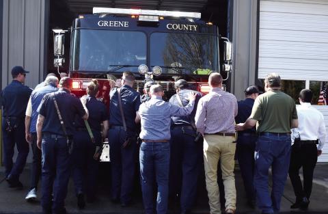 Greene County firefighters performed a traditional “push-in” ceremony last week for their new firetruck at Reynolds, mimicking the days when horse-drawn equipment had to be detached and pushed backward into the station in preparation for the next call. T. MICHAEL STONE/Staff