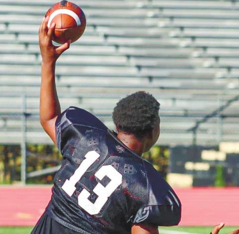 Zae’Veon Smith (13) attempts to find an open receiver downfield. LANCE McCURLEY/Staff