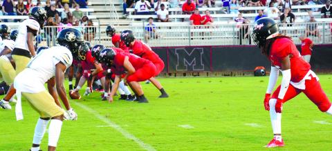 Morgan County spreads the ball out with quarterback Talan Fuller (14) under center and Jaydon Dorsey (1) out wide. BRENDAN KOERNER/Staff