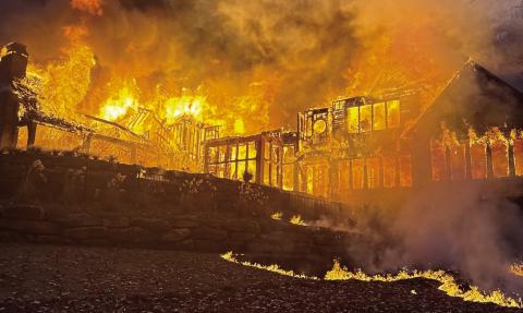 This photo taken from behind a 9,000 square foot home in Reynolds Lake Oconee captures the power of the blaze that destroyed most of the home. CONTRIBUTED