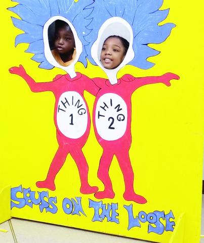 Two students pose as Thing 1 and Thing 2 during a previous Seuss on the Loose. CONTRIBUTED