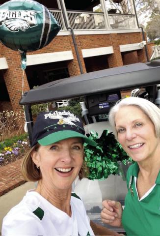 Nancy Simon (left) and Bonnie Snider cheer on the Philadelphia Eagles at The Preserve Course at Reynolds Lake Oconee. CONTRIBUTED