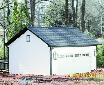 The carriage lights adorning each end of Madison resident Cynthia Huger's garage seem to have revealed a grey area for the city regarding the local Historic Preservation Commission's ruling decisions.