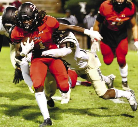 Jaydon Dorsey (1) tries to break a tackle in Friday night’s loss. JIM TURNER/Contributed