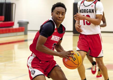 Morgan County senior King Hardy drives to the basket through defenders during an intrasquad scrimmage last week. SKYLA MORRIS/Staff