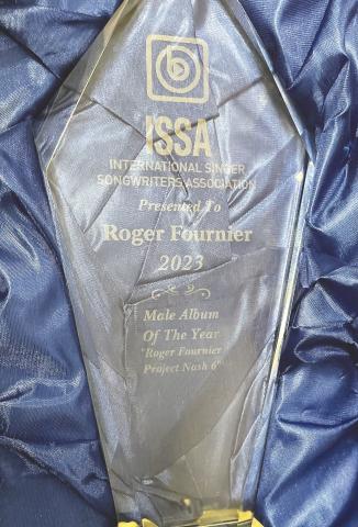 Roger Fournier picked up some hardware for his mantel in Eatonton with this 2023 International Singer Songwriters Association Gold trophy. CONTRIBUTED