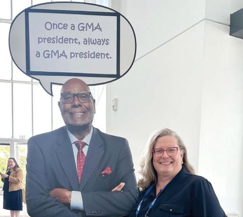 City of Madison Planning and Development Director Monica Callaway poses with a poster of Madison Mayor and former GMA president Fred Perriman while attending the association’s 2026 conference. CONTRIBUTED