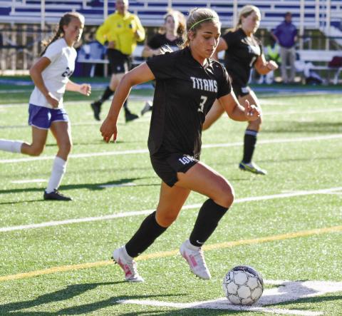 Titan forward Kensi Stevens (3) dribbles down the field in Lake Oconee Academy’s match against Johnson County earlier this week. T. MICHAEL STONE/Staff
