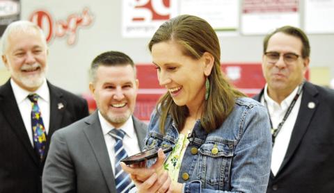 Morgan County High School’s Rachel Kinsaul calls her mom and husband to celebrate after winning the $25,000 Milken Educator Award. HANNAH BARRON/Staff