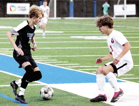 Palmer Larkin (7) tries to dribble the ball past a Lincoln County defender. WILL MORRISON/Staff