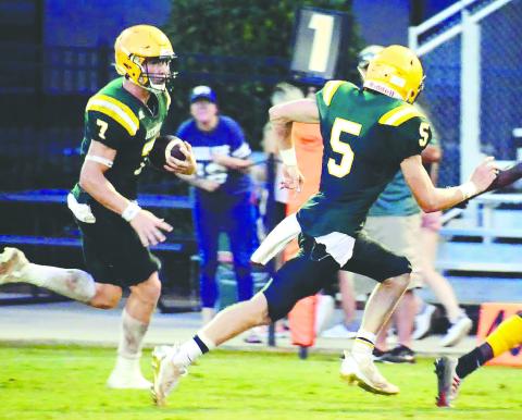 Fellow Gatewood seniors Evan Bennett (7) and Blake Callaway (5) each scored two touchdowns in the Gators’ 35-0 win over the Trinity Christian Crusaders Friday night in Dublin. FILE PHOTO
