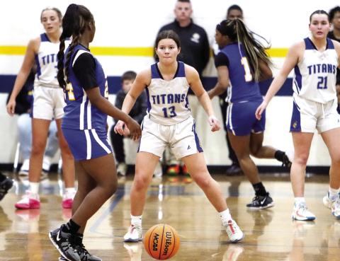 Lake Oconee Academy's Mary Claire McCommons (13) defends a Warren County guard in last season's region championship game. Head coach Savannah Soles tabbed McCommons as a player to watch next year. (LANCE MCCURLEY/Staff)