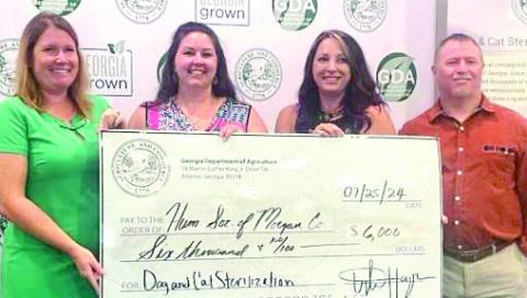 The Humane Society of Morgan County recently received a $6,000 grant on behalf of the Georgia Department of Agriculture’s Dog and Cat Sterilization Program. Pictured at the grant presentation are (L-R) Chelsea Turner, grant administrator; Miranda Johnson, director of operations for the Humane Society; Crystal Howard, programs manager for the Humane Society; and Jason Smith, Department of Agriculture representative. CONTRIBUTED
