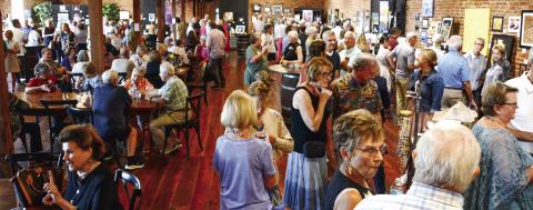 Last year’s Dual Vision: Art Through Different Eyes show attracted a huge crowd to downtown Eatonton’s Barrel 118 event center and a similar turnout is expected. IAN TOCHER/Staff