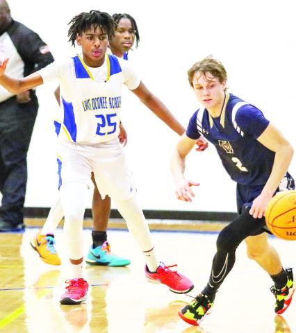 LOA’s Jaden Hillsman (25) guards an opponent in a win last December. The freshman forward earned All-Region Second Team honors this year. LANCE McCURLEY/Staff