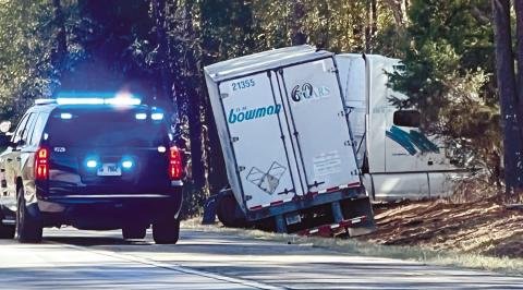 A truck ran off of I-20 into the wooded area near Siloam. HEATHER HARRIS/Staff