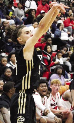 Tigers’ junior shooting guard Ryder Eschbach attempts a 3-pointer from the corner. TREY NORRIS/Staff