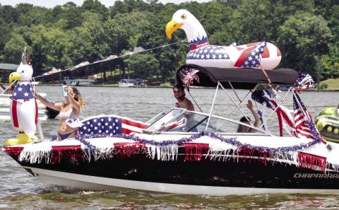 Event participants have gotten really creative over the years with their Fourth of July boat decorations. Scan the QR code above for the starting location. T. MICHAEL STONE/Staff
