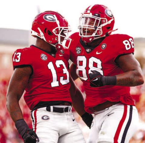 Georgia defensive linemen Mykel Williams (13) and Jalen Carter (88) celebrate during the win against Tennessee. TONY WALSH/UGA Athletics
