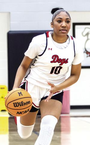 Morgan County sophomore Chloe Thompson (10) pushes the ball up the floor in transition. SKYLA MORRIS/Staff
