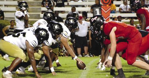 Greene County’s offense lines up against the Morgan County defense during the first half of their contest against each other. BRENDAN KOERNER/Staff