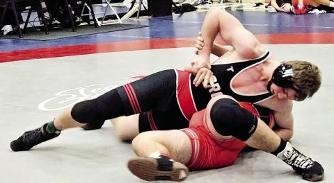 Morgan County senior wrestler Christopher Morgan tries to force his opponent to surrender this past weekend at the Class AAA state duals tournament, held at Lumpkin County High School. CONTRIBUTED