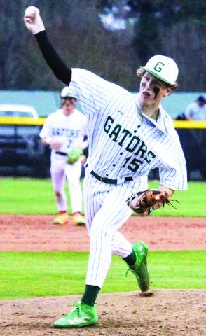 Gatewood senior Lawson Wooten (15) brings the heat last Tuesday in the Gators’ season opener at home against the Westfield Hornets. TREY NORRIS/Staff