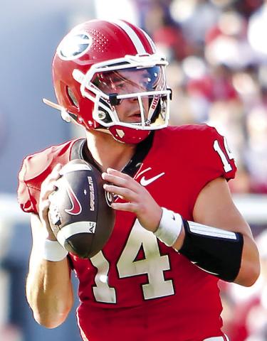 Georgia quarterback Gunner Stockton accounted for five touchdowns in the regular season matchup against Ole Miss in Athens on Oct. 15. LANCE McCURLEY/Staff