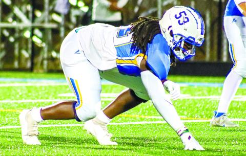Hall (53) takes a 3-point stance on the line of scrimmage in the Titans’ game against Cherokee Christian on Sept. 29, 2022, at Tucker Field. LANCE McCURLEY/Staff