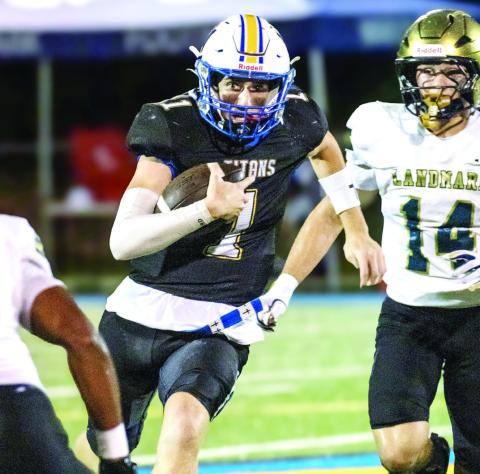 LOA sophomore quarterback Jake McDonald (1) runs past Landmark Christian defenders, trying to get a first down. SKYLA MORRIS/Staff