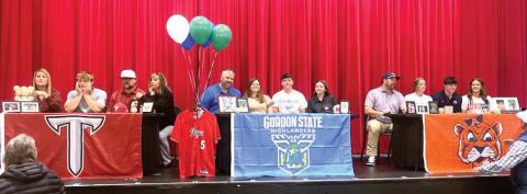 Morgan County baseball seniors Hudson Reed (left), Caylem Richardson (middle), and Ty Tillery (right) held a signing ceremony on Wednesday, Nov. 12, in the school’s auditorium. CONTRIBUTED