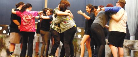The “Godspell” cast practices a scene where the characters hug and rejoice after learning about Jesus’ everlasting love. BAILEY BALLARD/Staff