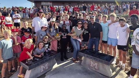 Community members gathered May 13 for the unveiling of benches dedicated in memory of middle school students Avett Jackson and Bennett Rabern who tragically lost their lives in an ATV accident in January. CONTRIBUTED