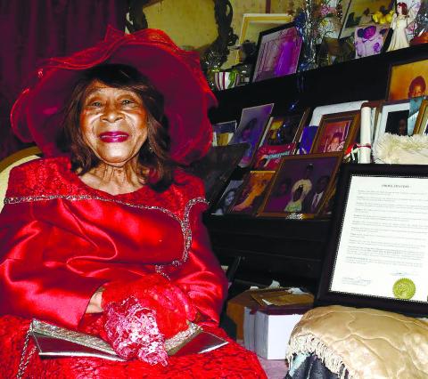 Essie Mae seated beside the proclamation she received. IAN TOCHER/Staff