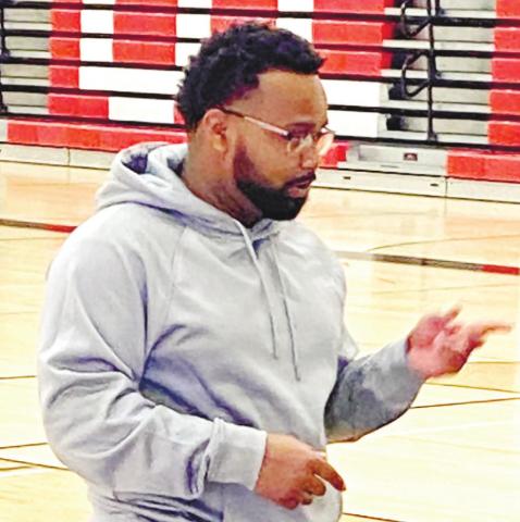 Milfred Franklin instructs a group of middle schoolers this past winter during a game. CONTRIBUTED