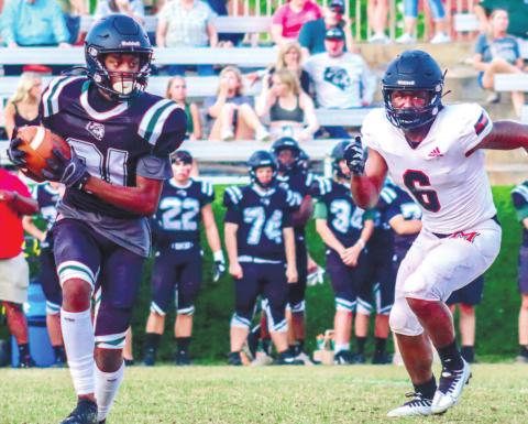Morgan County edge defender DJ Smith (6) chasing down a Walnut Grove running back. LANCE McCURLEY/Staff