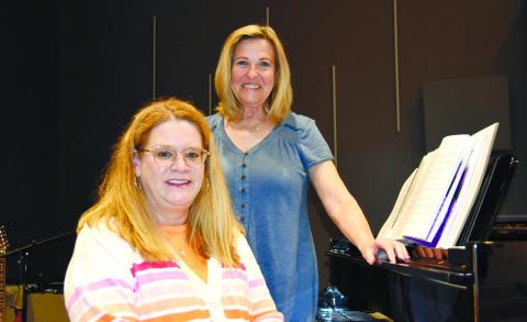 Music directors Amy Reber (seated) and Donna Valvo are considered the “heart and soul” of Greensboro’s Lake Country Chorus. CONTRIBUTED