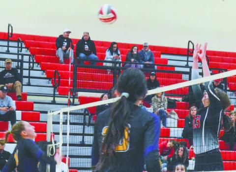 Morgan County’s Chloe Burns (13) goes up for a block in the first round of the state playoffs against the Calvary Day Cavaliers. BRENDAN KOERNER/Staff