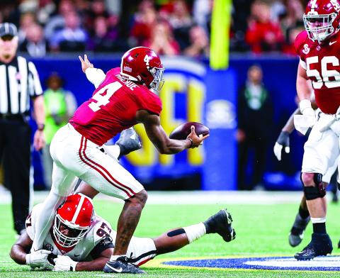 Georgia defensive lineman Warren Brinson (97) recorded a sack on Alabama quarterback Jalen Milroe (4), a tackle for loss and three tackles in the 2023 SEC Championship game in Atlanta. TONY WALSH/UGAAA