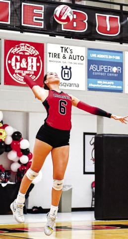 Senior outside hitter Quinn Butler (6) gets set to serve in a match against Jefferson last week. CHARLES JORDAN/Staff
