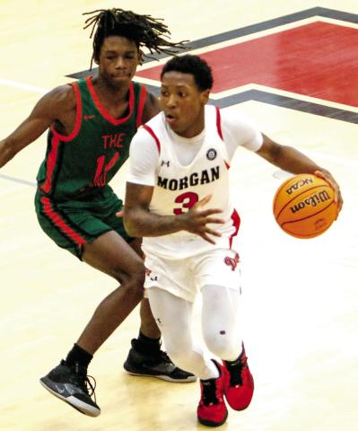 Morgan County’s Zeki Locus (3) was named Co-Region 2-2A Player of the Year after averaging 13.4 points, 9.0 rebounds, 5.8 assists, and 3.8 steals per game as a junior for the Dogs. LANCE McCURLEY/Staff