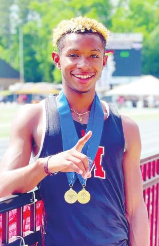Jones poses for a photo with his gold medals from the Class AAA state track meet. CONTRIBUTED